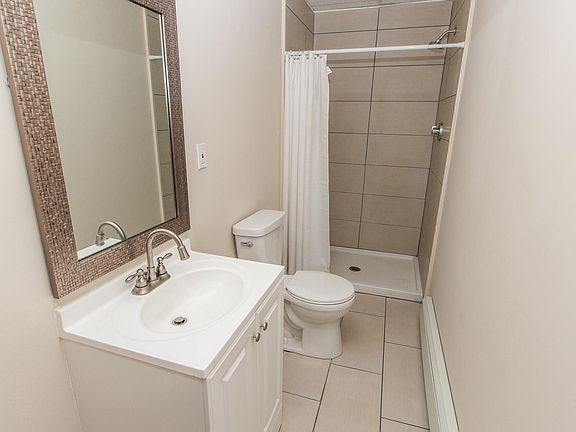 Bathroom with roomy custom tile shower