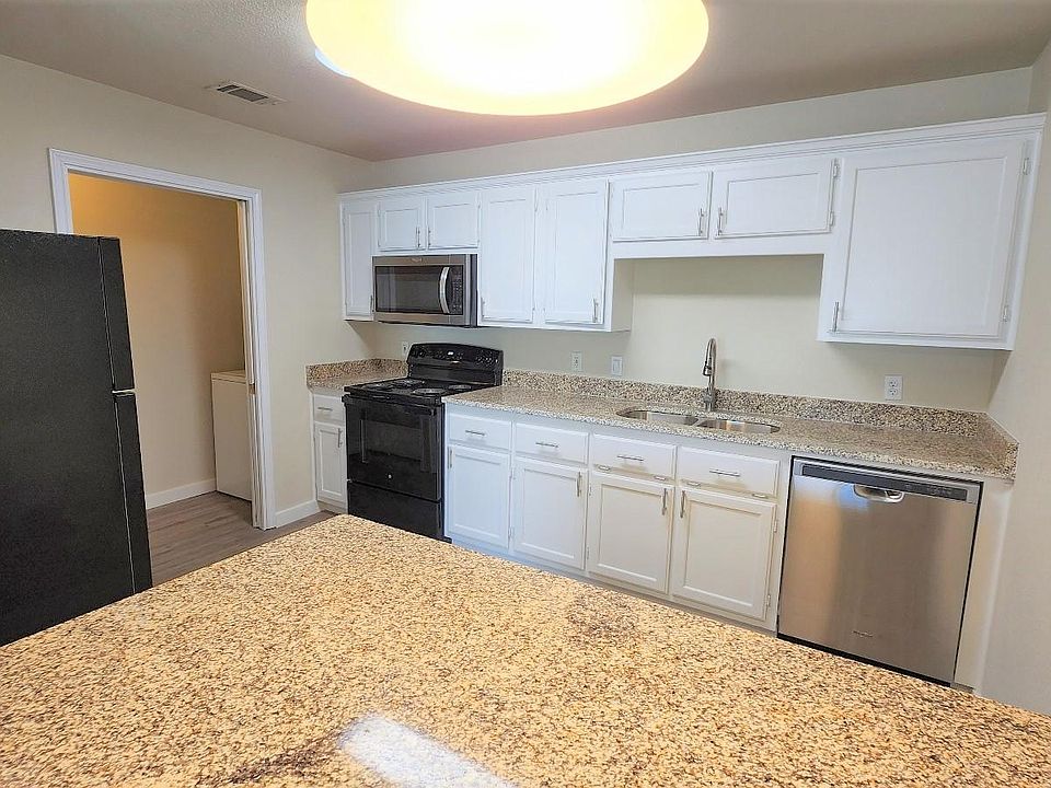 Fully remodeled kitchen with all new applicances in 2023 including a microwave and granite countertops.