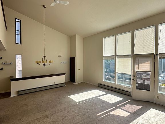 Living room with floor to ceiling windows facing NE 71st St.