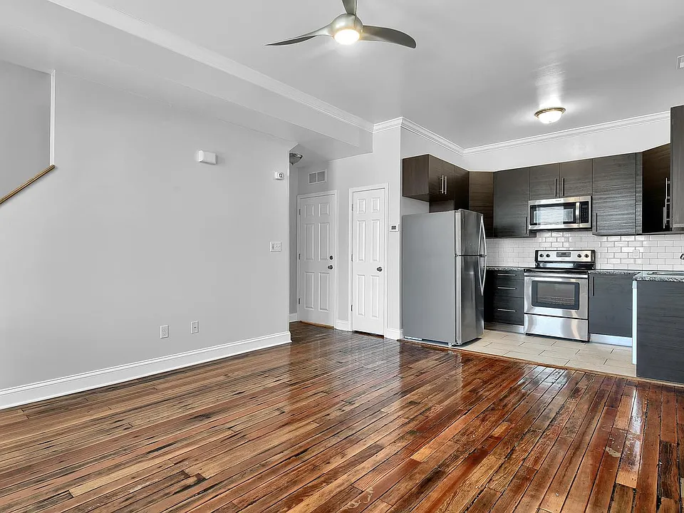 kitchen & family room - level 1: contemporary open floor plan, salvaged wood floors, crown moulding