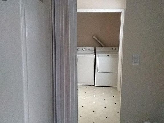 Laundry room near the kitchen. washer and dryer,