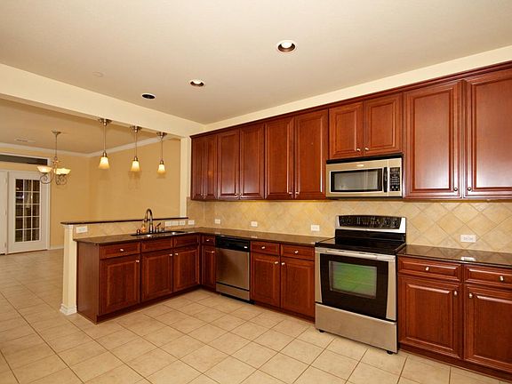 HUGE kitchen with SS appliances, granite counter top and bea