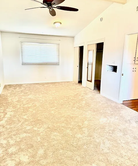 Expansive master bedroom with cozy carpeting and a pet-friendly layout. Originally two rooms combined into one, this space offers exceptional comfort and room to relax.