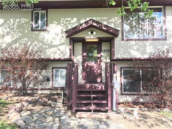Welcoming front door with covered porch.