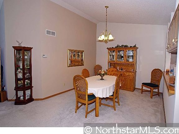 Formal dining room with a high vaulted ceilng. Plenty of room for your buffet 