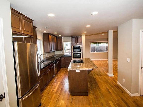 Great room, excellent for entertaining . Many cabinets and pantry for lots of kitchen storage.