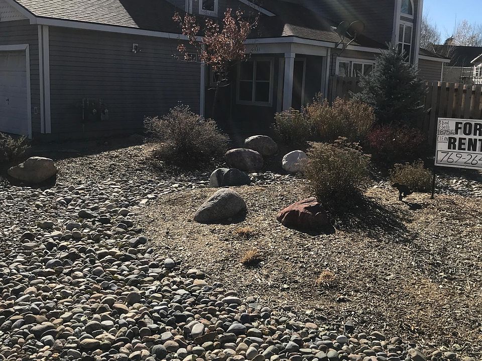 Landscaped front yard and new fencing all around. Porch and entry.