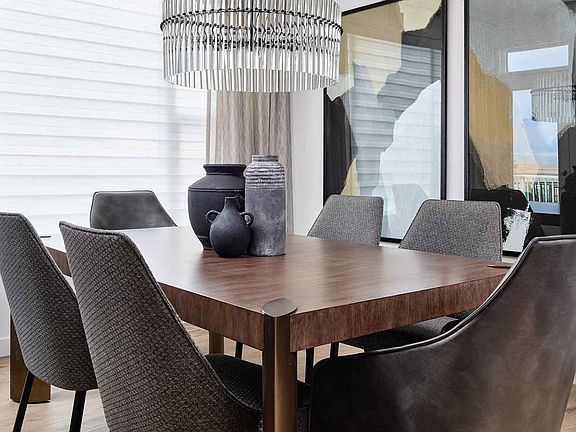 Dining in the glow of elegance. Our well-lit dining area is a symphony of warmth and style, with a c