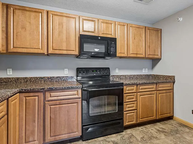 Classic cabinetry, generous counter space, and a functional layout make this kitchen as practical as it is inviting.