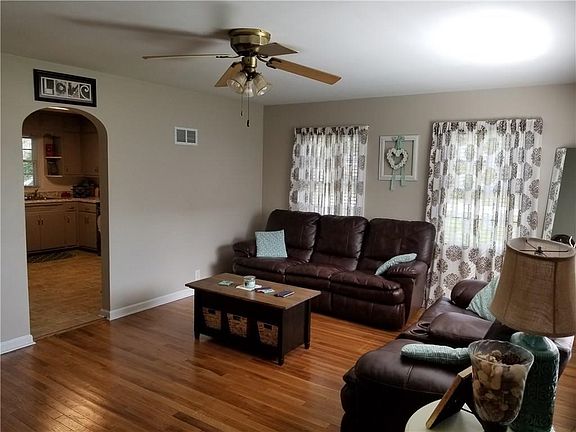 Awesome living room with gleaming hardwood floors...