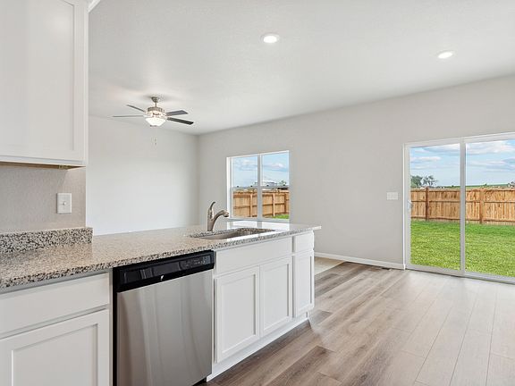 The dining space in the Chatfield is located next to the kitchen.