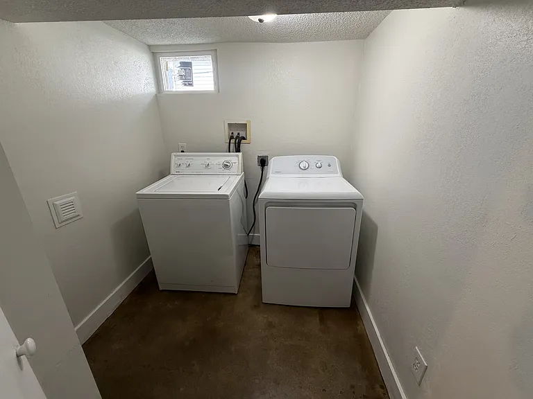 Laundry room. The washer and dryer were left by the previous tenants.