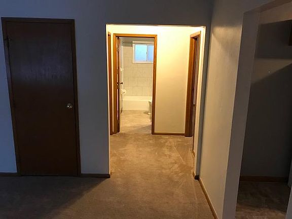 Hallway to bath and two bedrooms