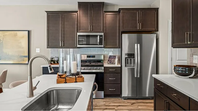 Staged Pic from Model home, Open Kitchen with All Stainless Steel Appliances