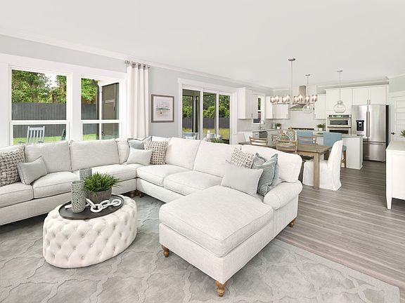 Large Gathering Room that looks over the Dining and Kitchen areas.