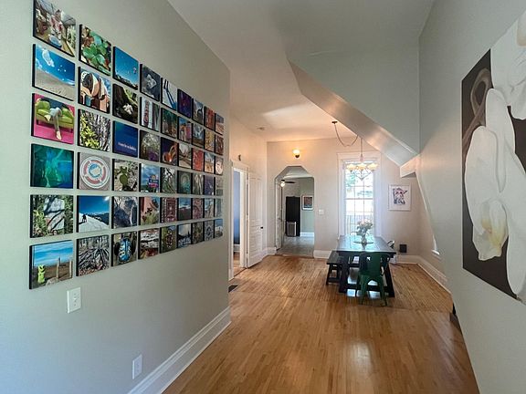 12 foot ceilings, classic ceiling fans, and tons of natural light, refinished white oak floors throughout