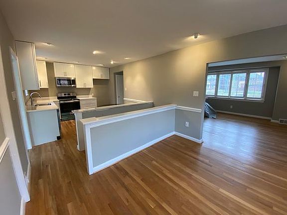 View from the dining room into kitchen and living room.