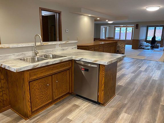 Kitchen island with view to dining area and family room