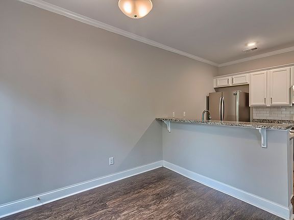 Dining room and Kitchen for the Charleston house plan.