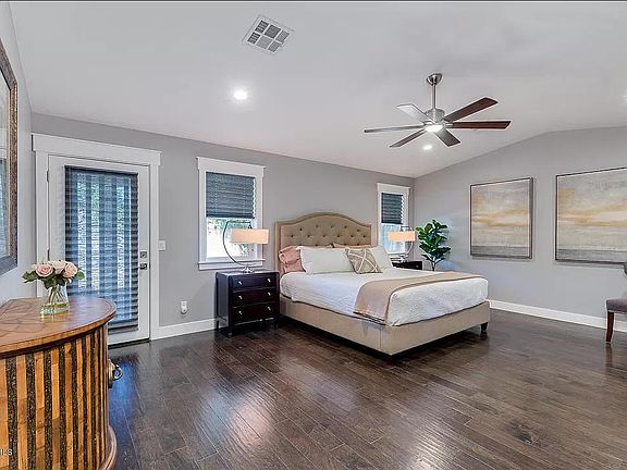 Master Bedroom with Vaulted Ceiling and private door to the backyard patio