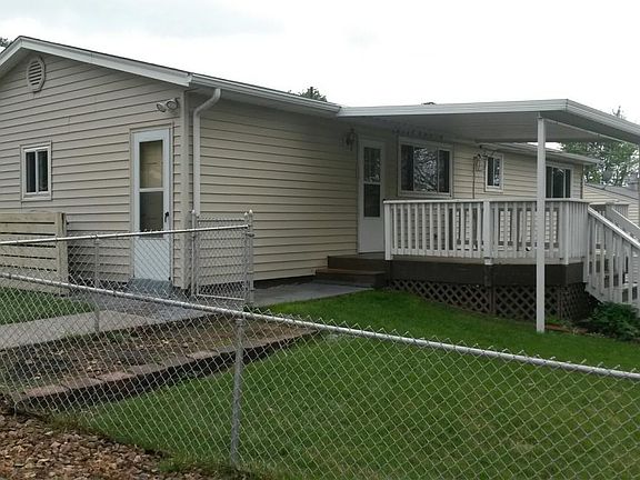 View of side yard and deck