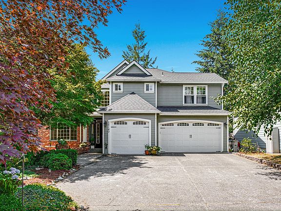 large and flat parking space with 3 car garage. New smart garage door with camera installed in 2023