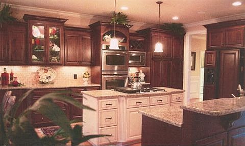 Gourmet Kitchen has custom cabinets, granite, cooktop, double oven