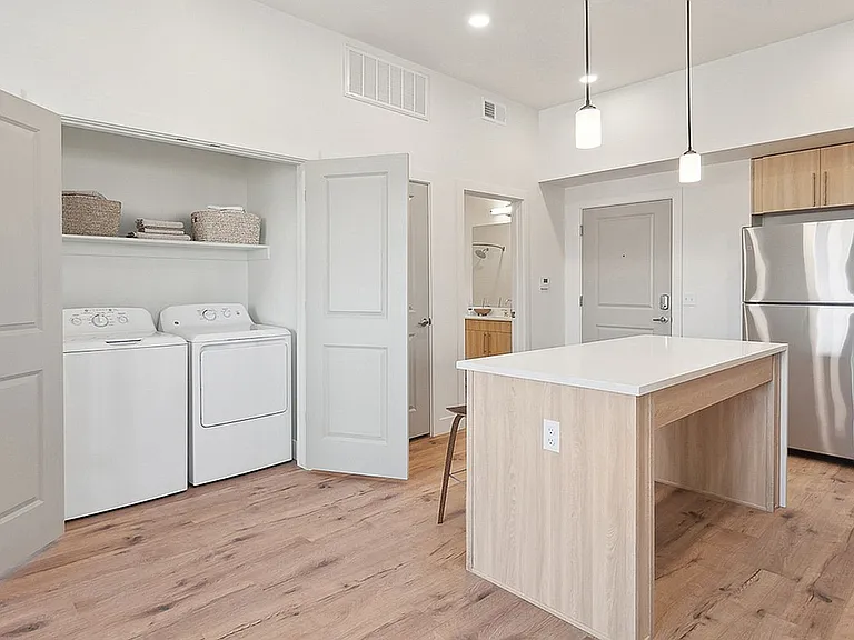 Kitchen and Laundry Room at Current Apartments