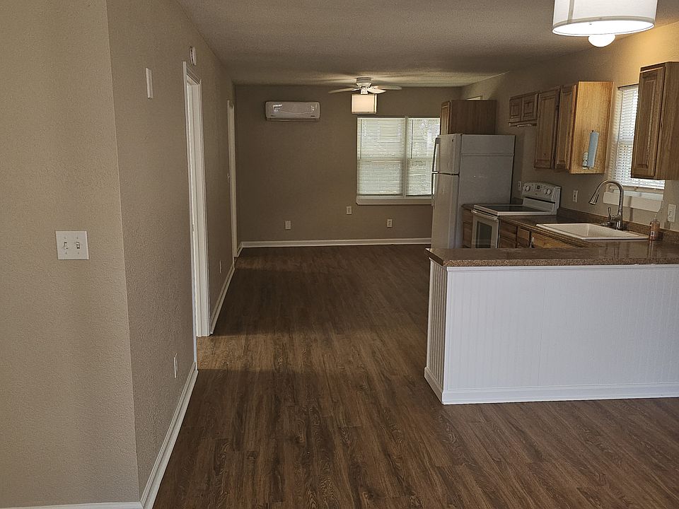 Walking in the front door. Flex room to the left. Living to the right.