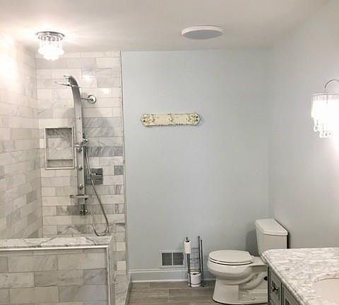 Master Bathroom w/ Carrera subway tile shower w/ rain and hand held shower sprayers & bird claw soaking tub