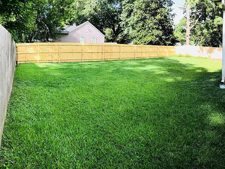 Another angle of the fenced back yard.