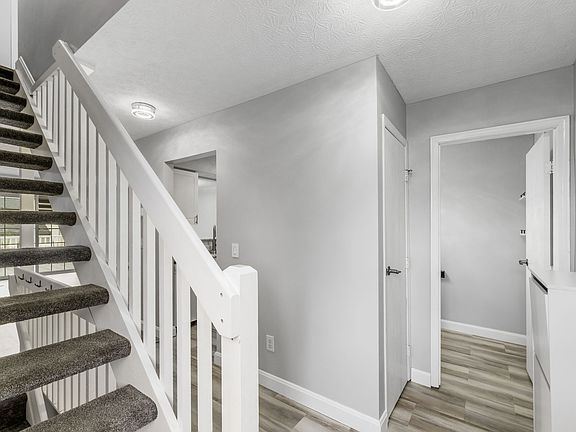 ENTRANCE WITH HALF BATH AND PANTRY TO THE RIGHT