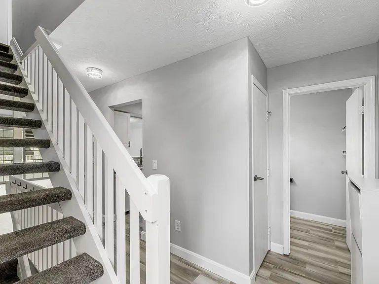 ENTRANCE WITH HALF BATH AND PANTRY TO THE RIGHT