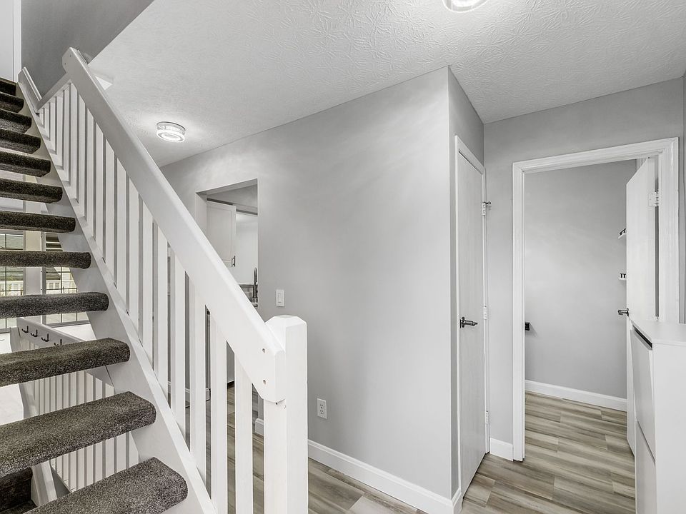 ENTRANCE WITH HALF BATH AND PANTRY TO THE RIGHT