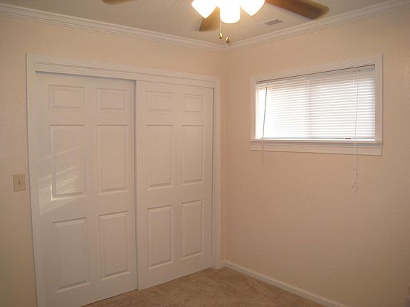 closet and a ceiling fan, in the bedroom