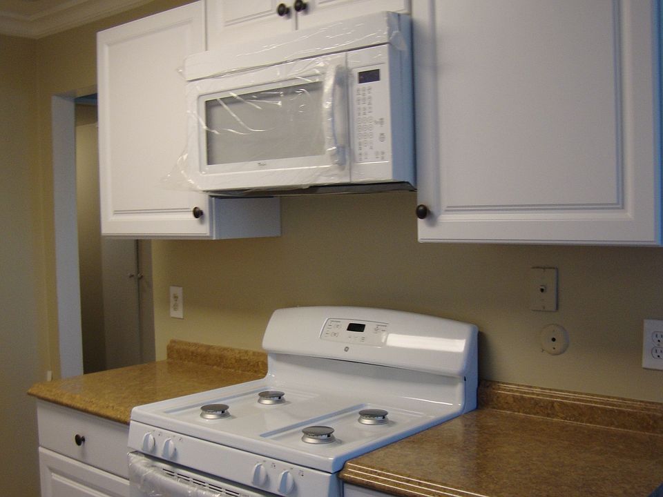 new cabinets, stove, microwave