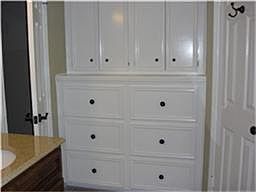 Storage is a breeze with the built ins in master bath and his and hers closets.