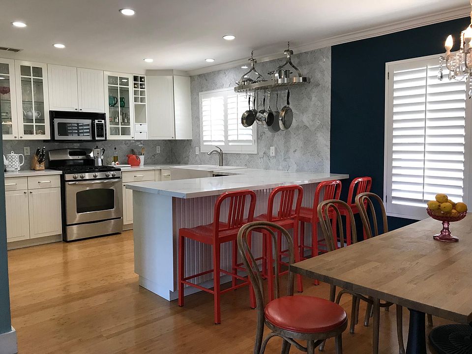 Quartz countertops. Stainless steel appliances. Large, farmhouse sink. Pullout pantry and plenty of drawer and cabinet storage.
