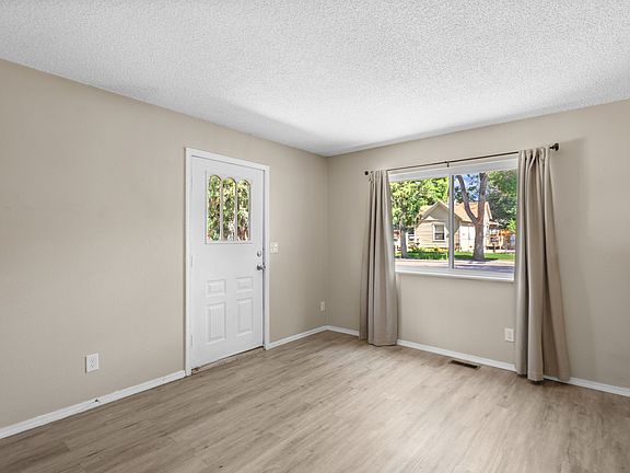 Bright living room with LVP flooring.