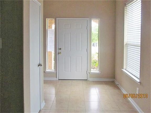 Entry has two side lights on either side of the front door and a front hall closet.