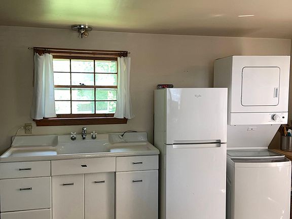 This is the kitchen area and washer dryer, which is on the main level. The window faces north toward the rest of the back yard.