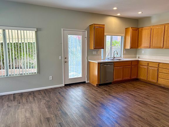 Kitchen, door to patio, part of family room (left)