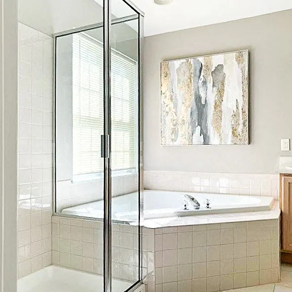 Primary bathroom with soaking tub and step-in shower (available in select units)