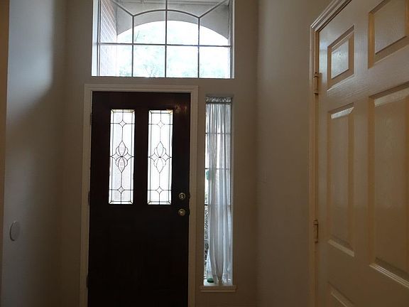 Entry with transom and sidelight. HIgh ceilings in home and entry.