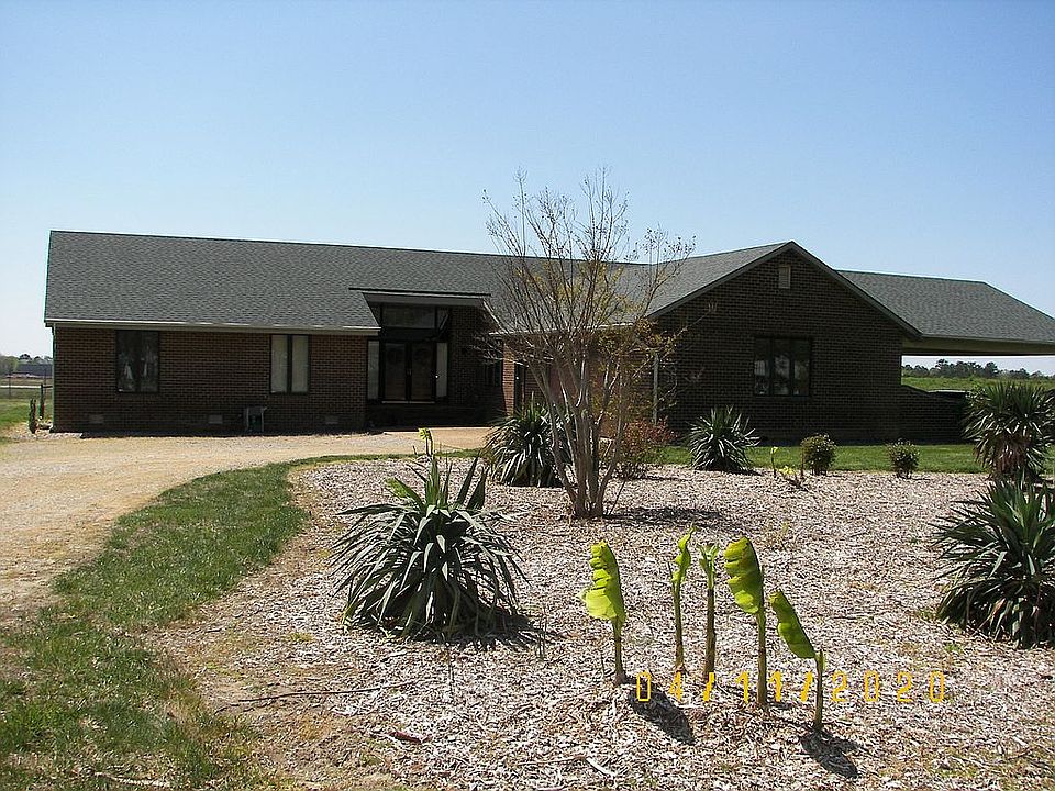 FRONT AS SEEN FROM DRIVEWAY