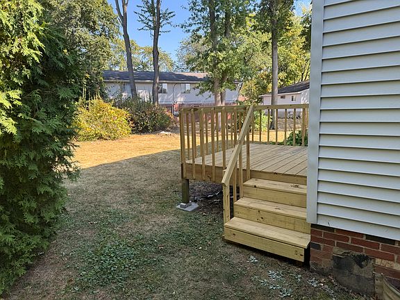 New deck off kitchen with large private backyard