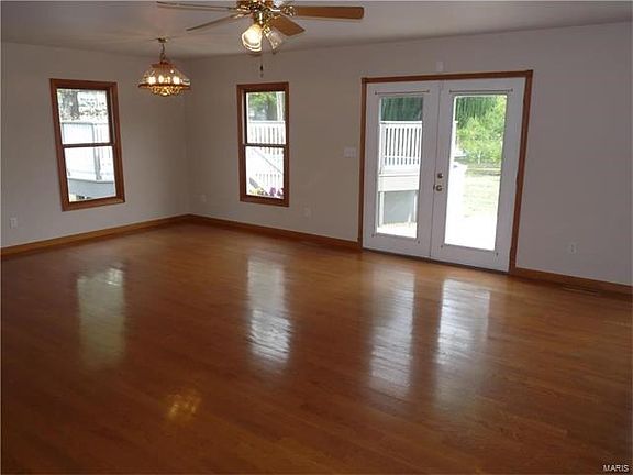 French doors in family room lead to HUGE patio, fenced yard with perennials and above ground pool with low maintenance decking.