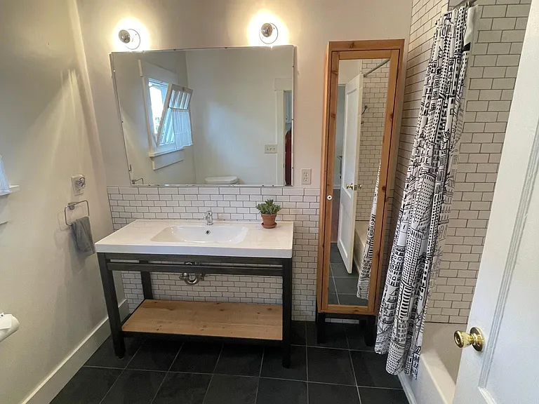 mirrored storage bolted to wall