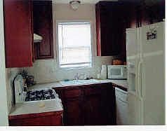 Kitchen with cherry stained cabinets
