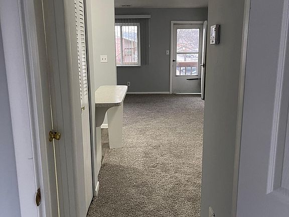 View of front door from bedroom